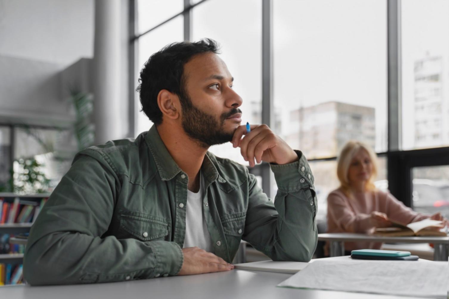 Business professional reviewing investment analysis documents